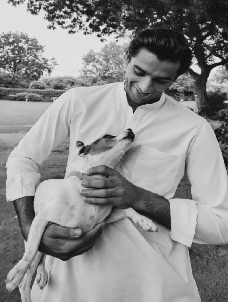 Padmanabh Singh, the Maharaja of Jaipur, holding a rescued indie dog in support of dog adoption in Jaipur. 
