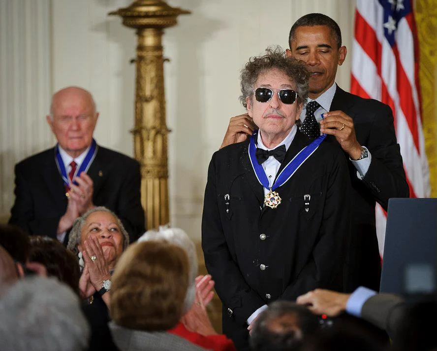 President Barack Obama presents Bob Dylan with the Presidential Medal of Freedom at the White House, May 2012