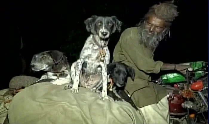 Sadhu and his dogs travel